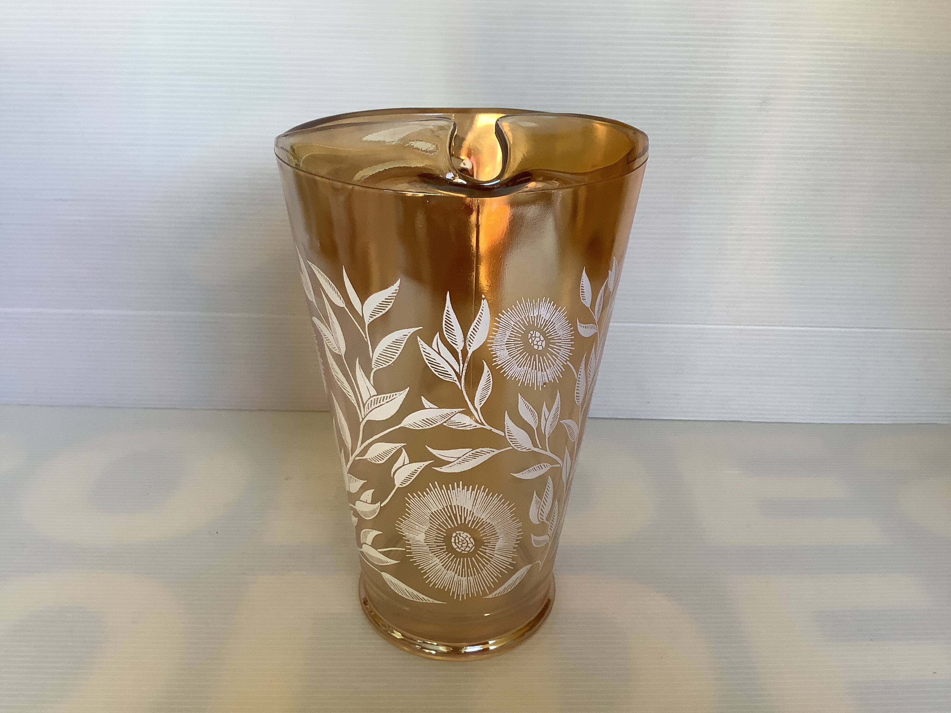 Service of marigold lemonade with iridescent reflections.