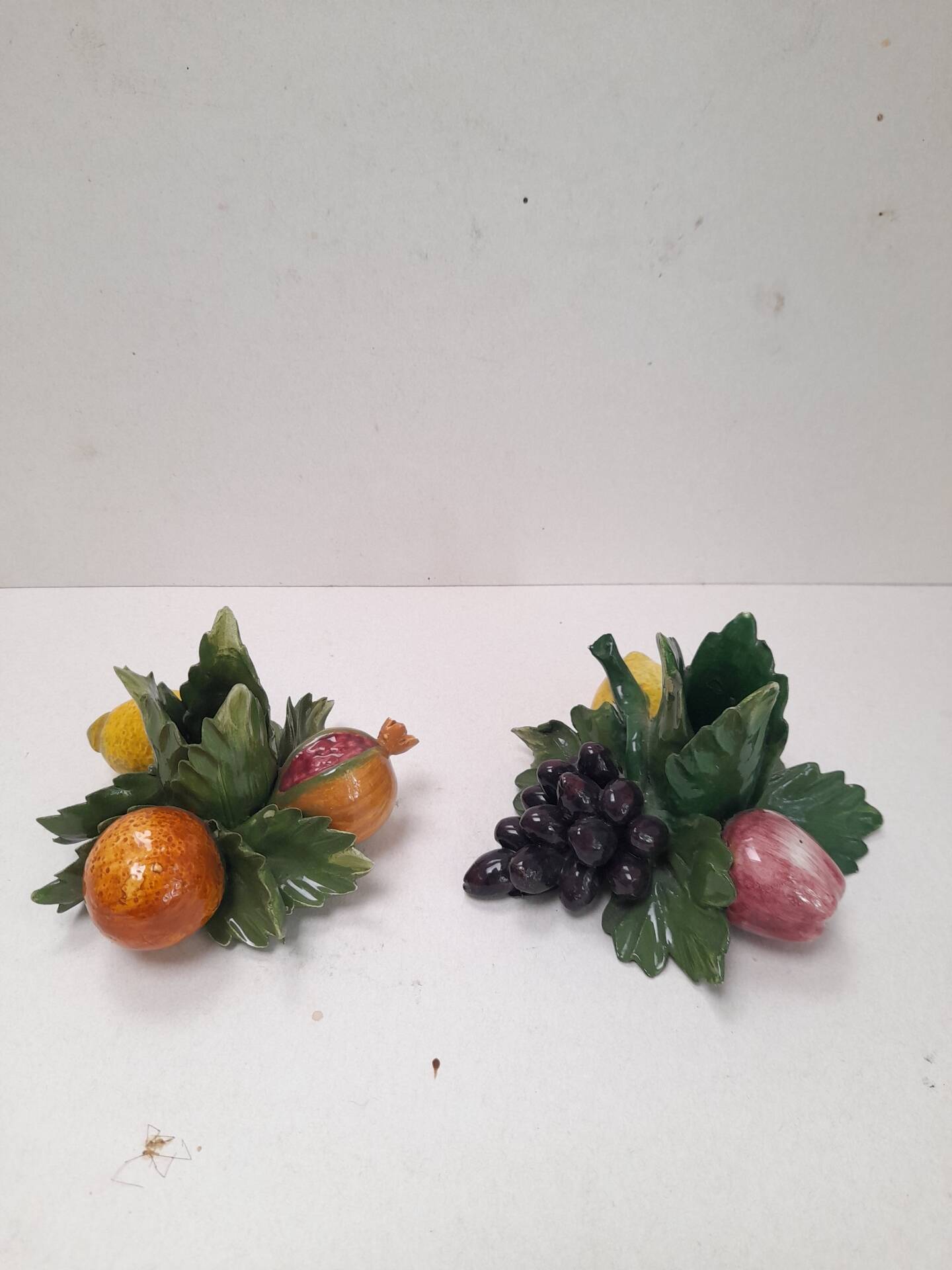 Pair of fruit candle holders in Italian majolica.
