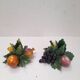 Pair of fruit candle holders in Italian majolica.