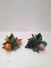 Paire de bougeoirs fruits en barbotine italienne
