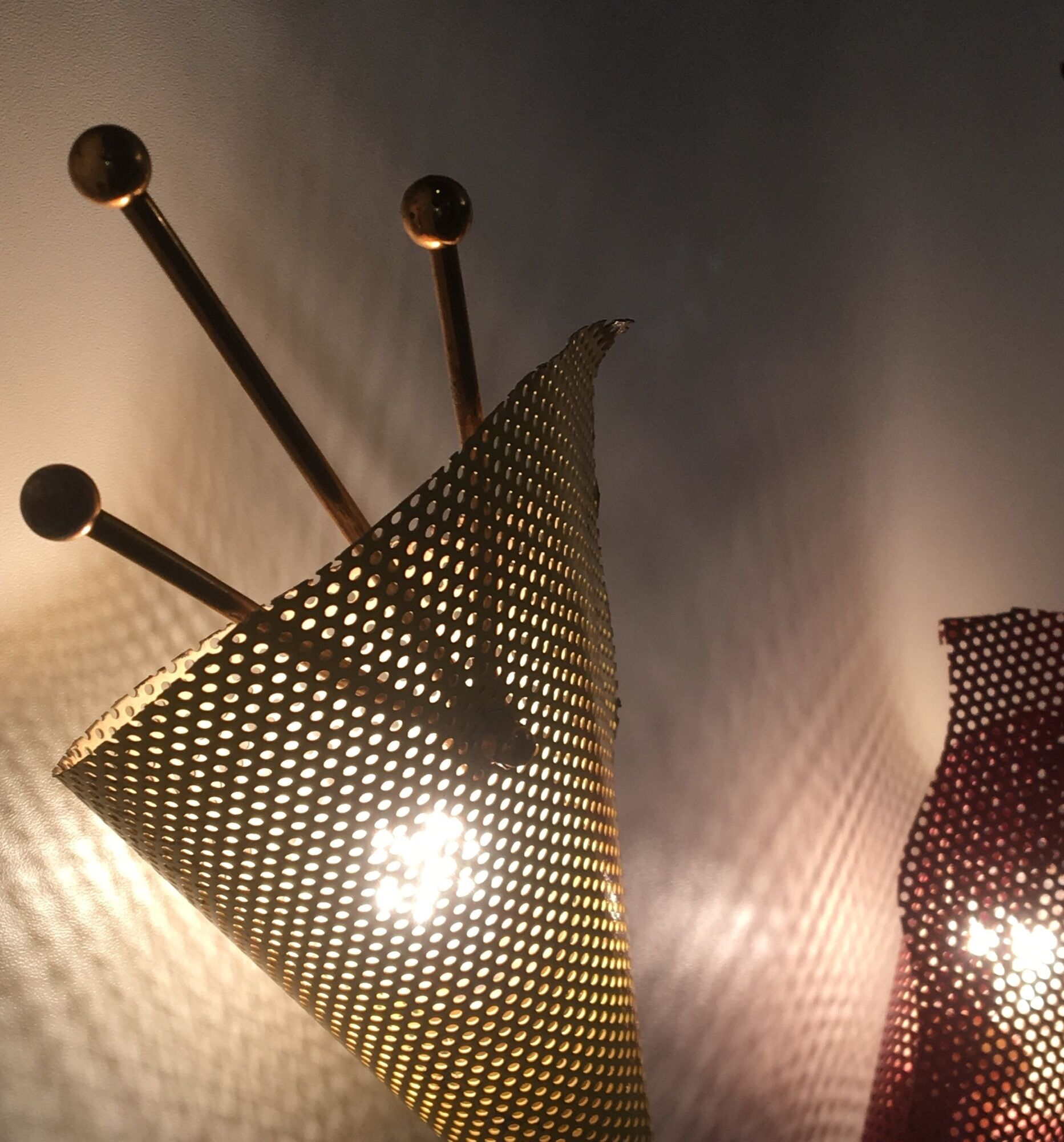 Pair of wall lamps metal perforated color, France 1950