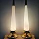 Pair of Hollywood Regency table lamps in brass with glass shades.