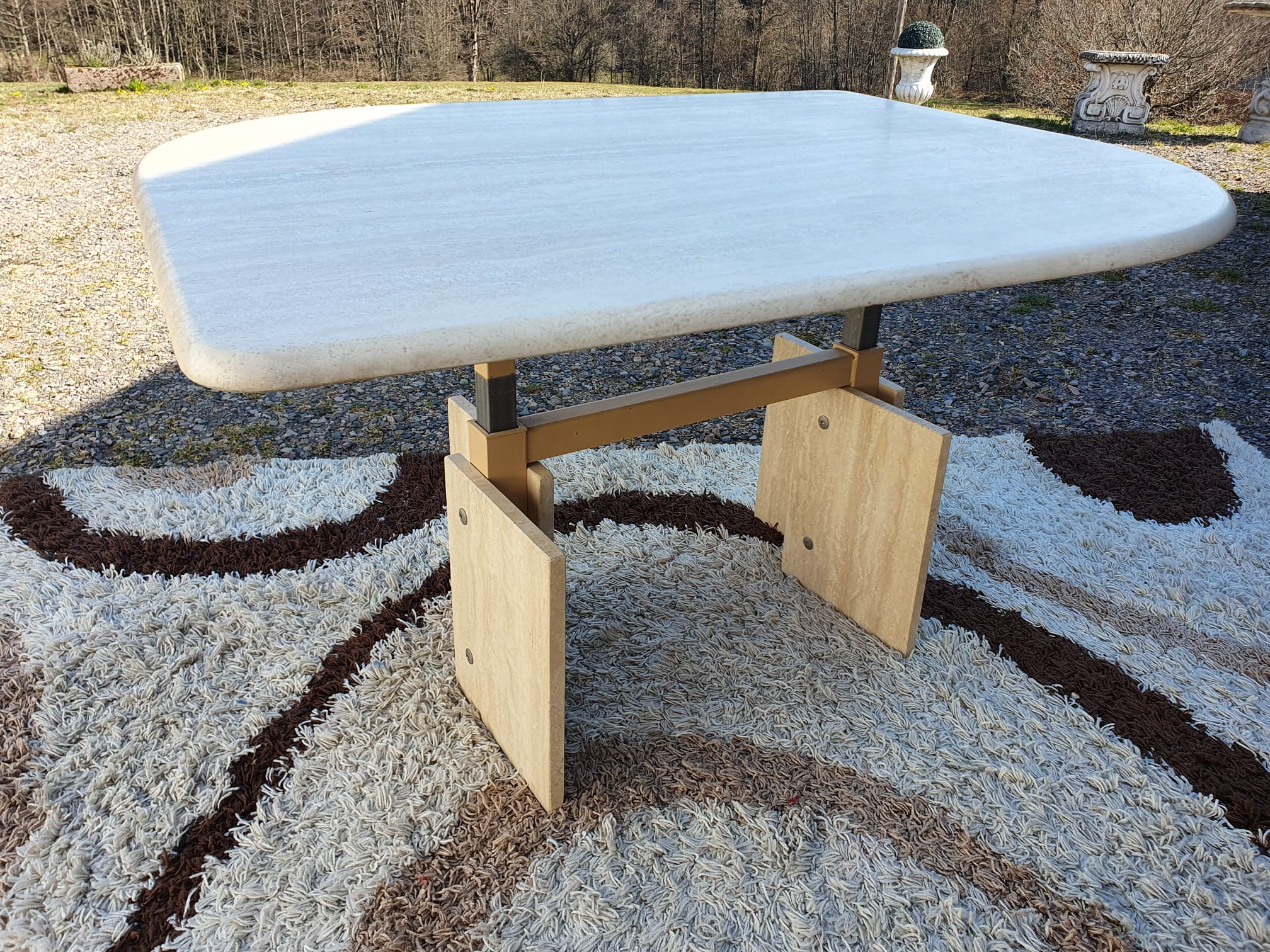Adjustable travertine coffee table eye shape