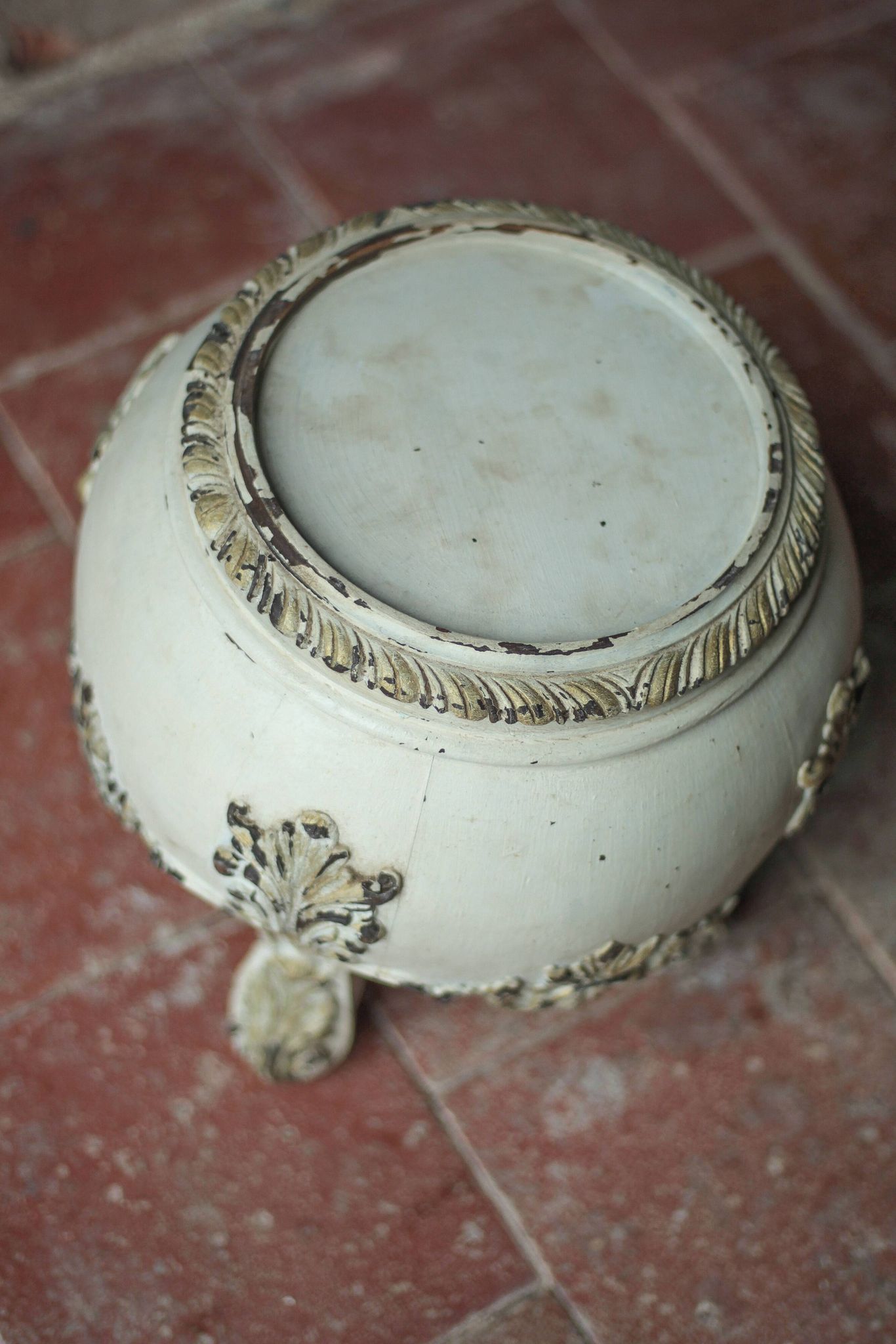 Solid wood plant stand with Louis XV style palm leaf motifs.