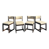 Many mid-century vintage wooden and fabric chairs.