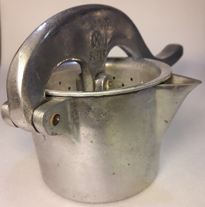 Vintage grapefruit metal citrus press