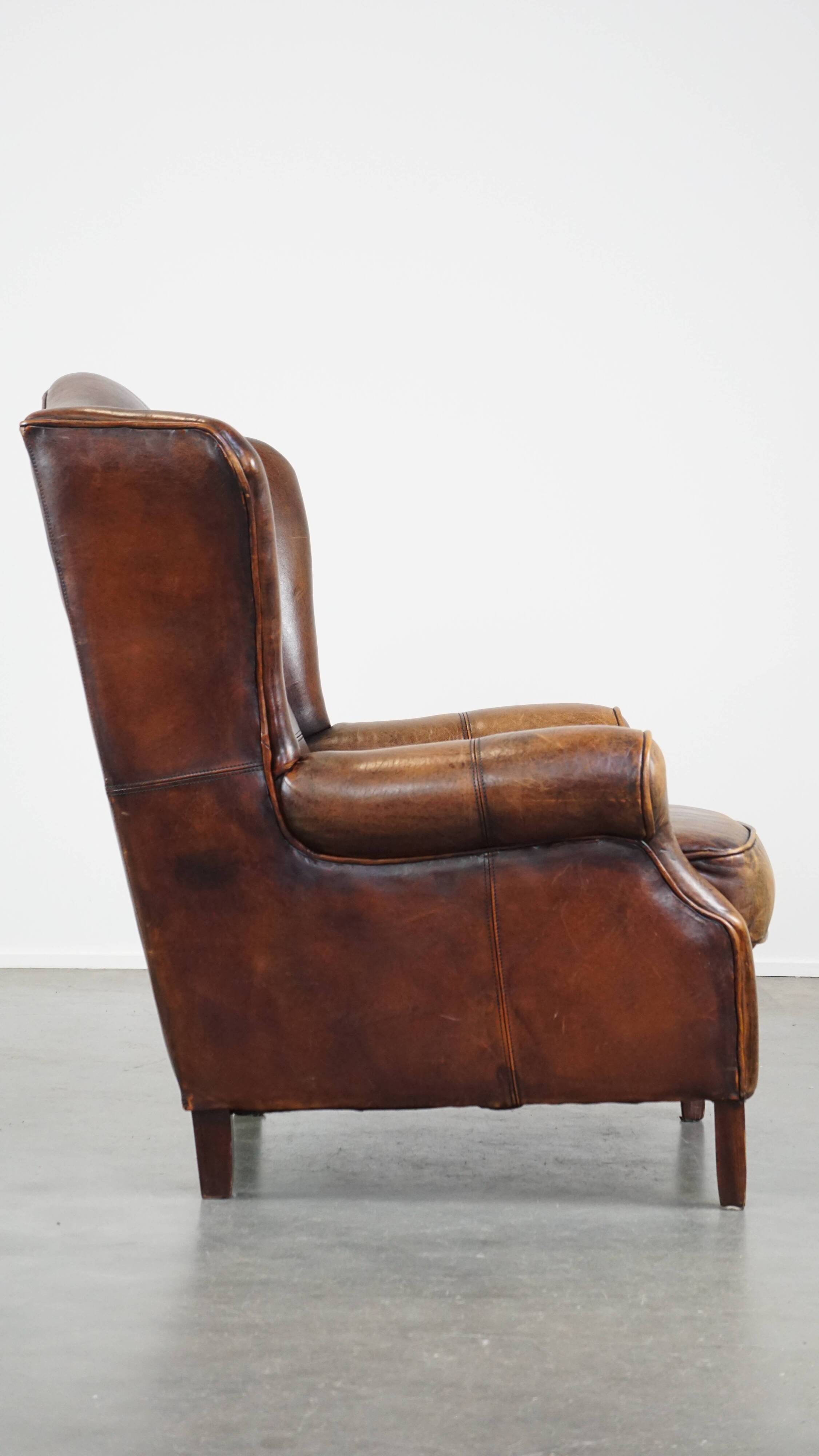 Fauteuil à oreilles en cuir de mouton