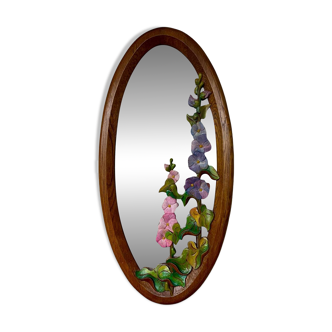 Carved wooden mirror with flower decorations