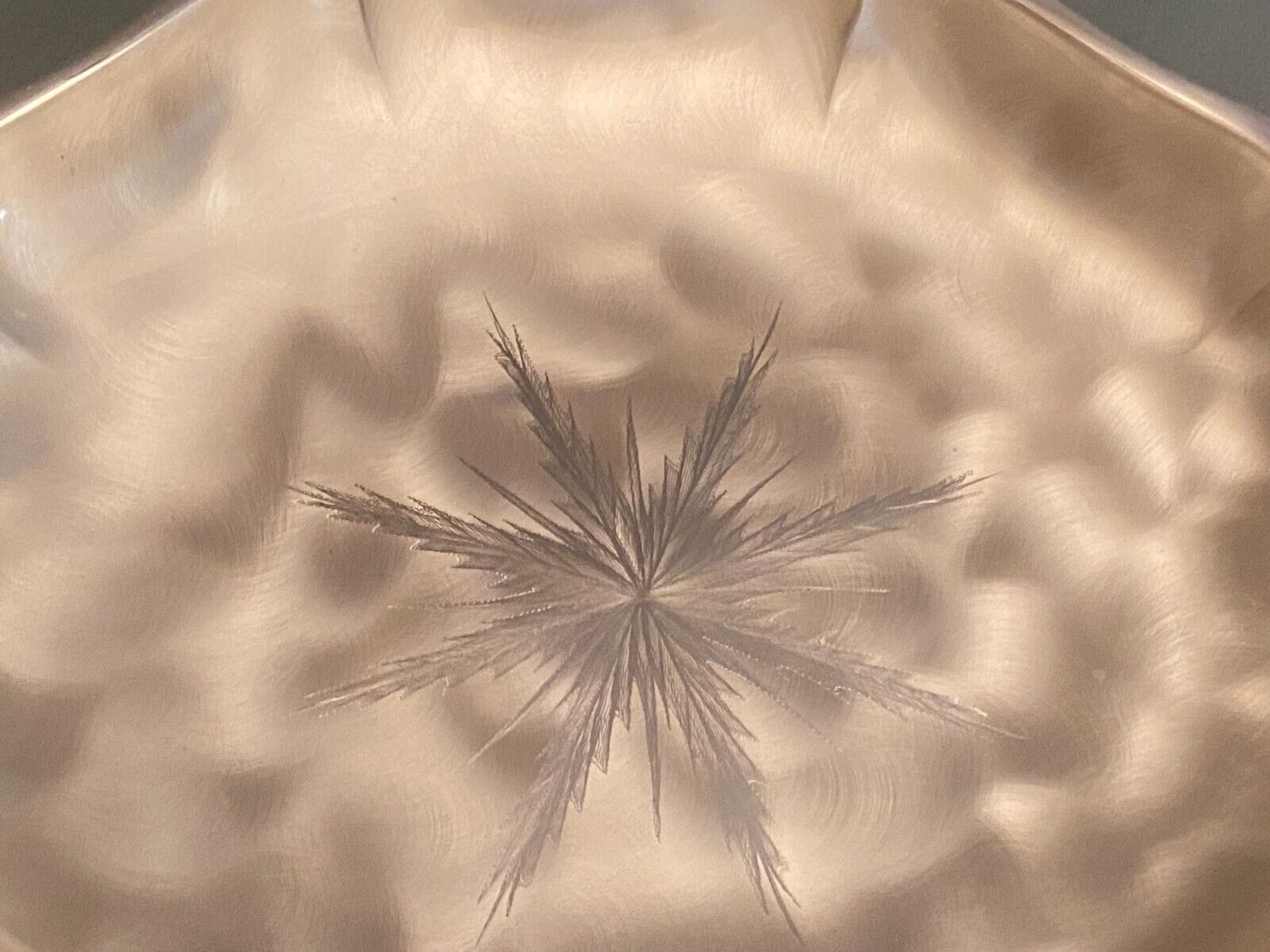 Metal dish with starry decoration
