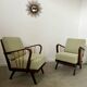 Set 2 old designer fireside chairs from the 50s wood and vintage fabric