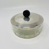 Vintage box made of chiseled glass and covered metal, taken in black Bakelite