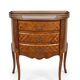 Small curved chest of drawers in Louis XV style with marquetry.