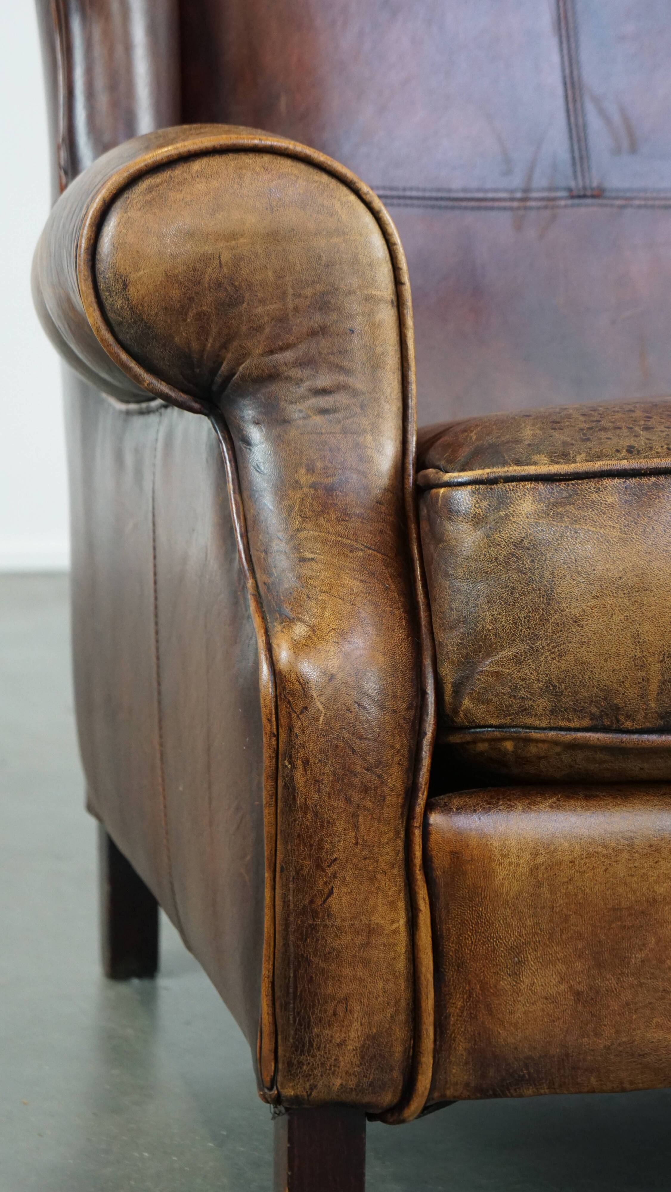 Fauteuil à oreilles en cuir de mouton