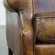 Fauteuil à oreilles en cuir de mouton