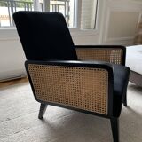 Fauteuil en velours noir et cannage