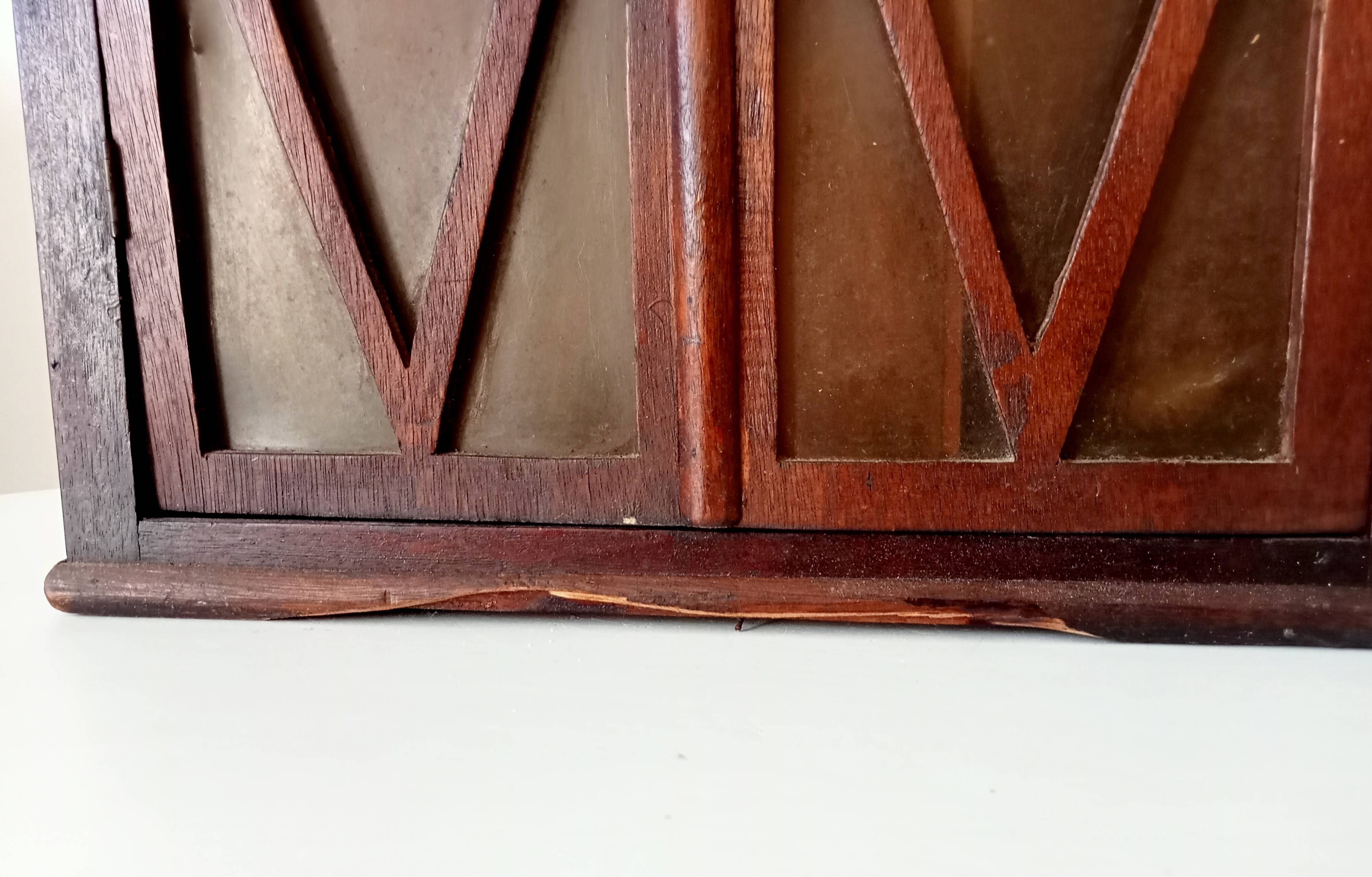 Small antique wall cabinet in Gothic style.