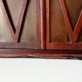 Small antique wall cabinet in Gothic style.