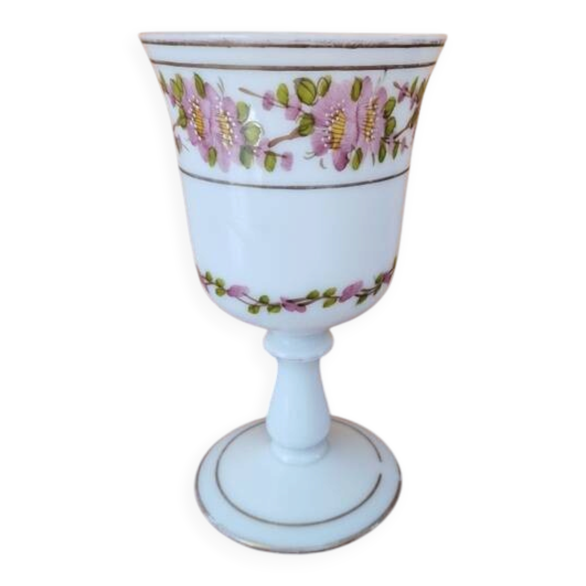 Footed glass in the shape of a chalice in white opaline with a floral decoration.