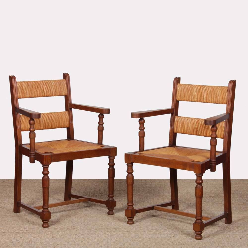Pair of oak straw-seated armchairs from the 1950s.