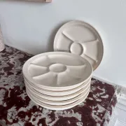 The earthenware fondue plates from Haute-Provence.