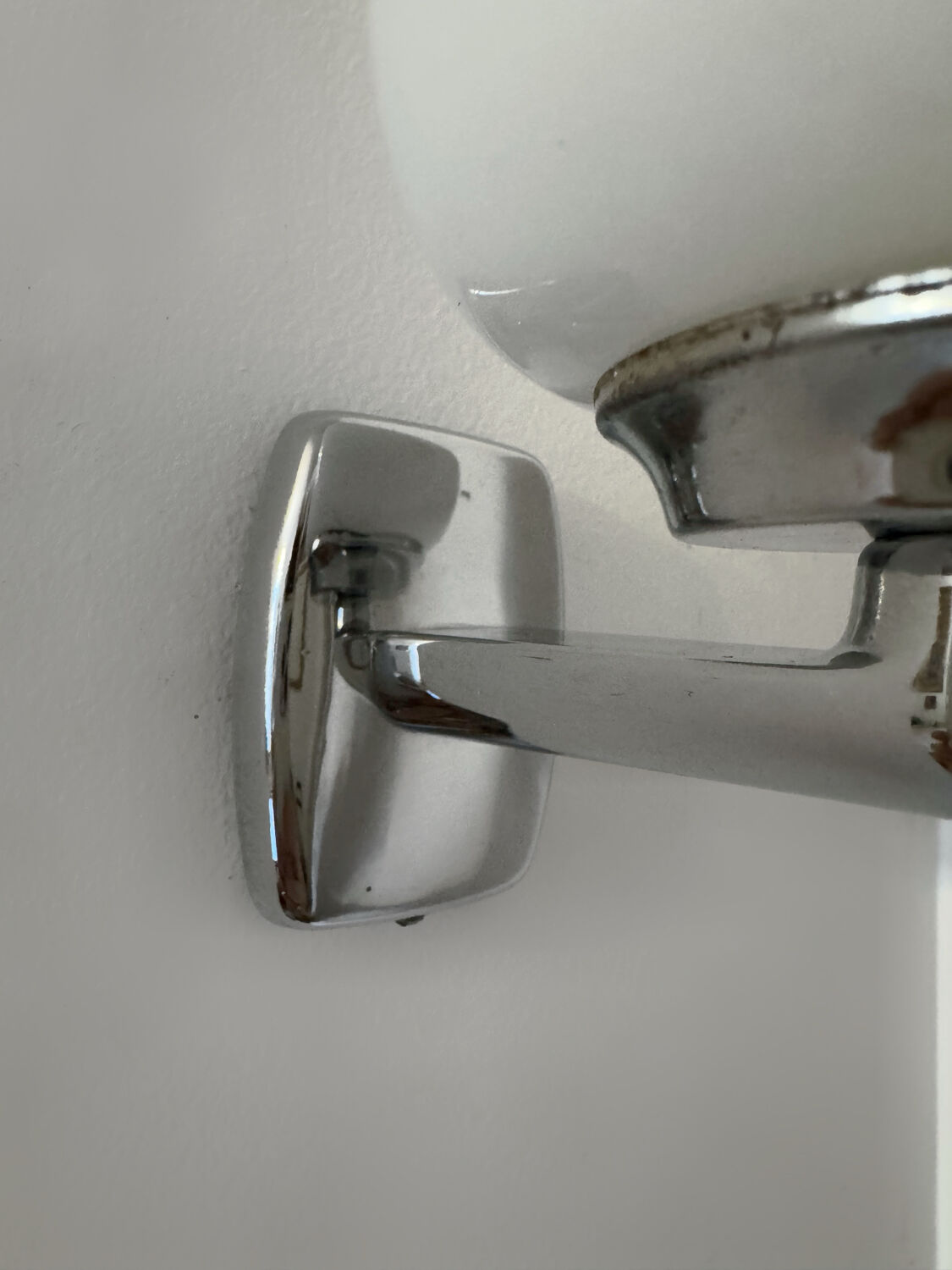 Chrome and opaline wall lights from the 70s.