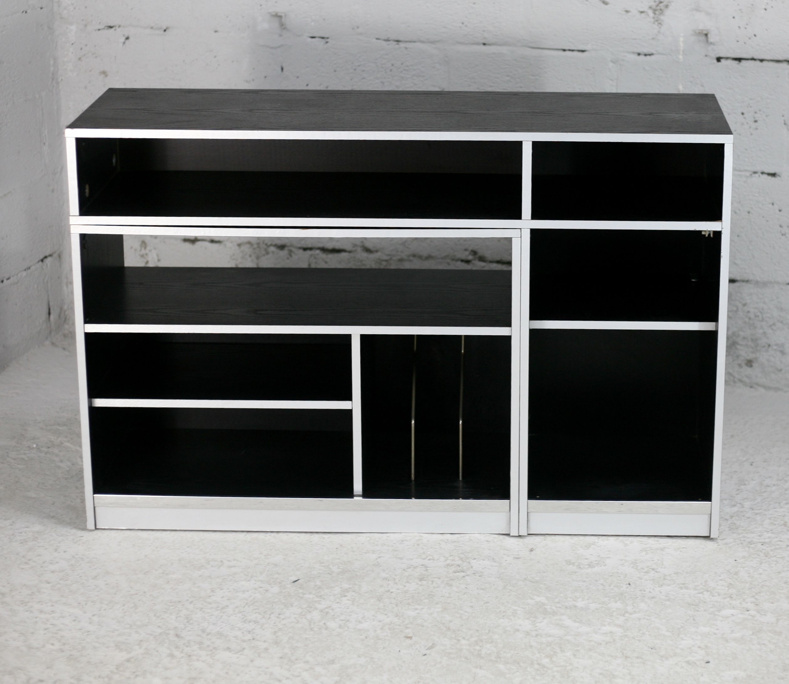 Storage cabinet wood compressed lacquered black lining margins aluminum. France, circa 1975.