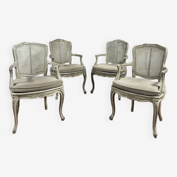 Suite de quatres fauteuil canné en bois laqué gris estampillé gouffé de style louis xv