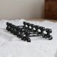 6 vintage black metal knife rests with scroll decorations