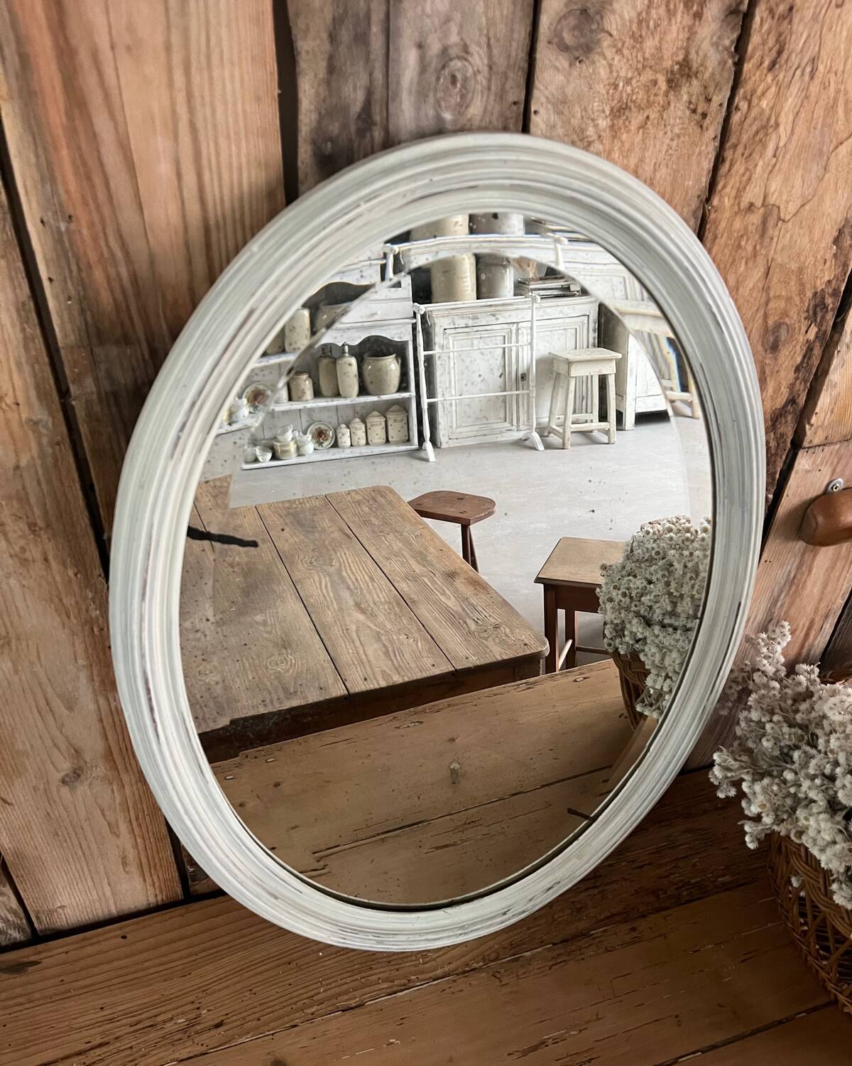 White patinated oval mirror
