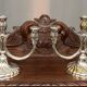 A pair of candlesticks. silver metal with gold decoration.