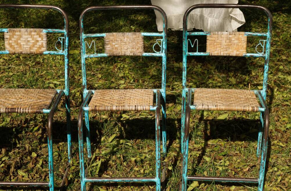Wrought iron and rattan garden chairs