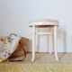 Vintage curved wooden stool in Baumann style, striped seat.