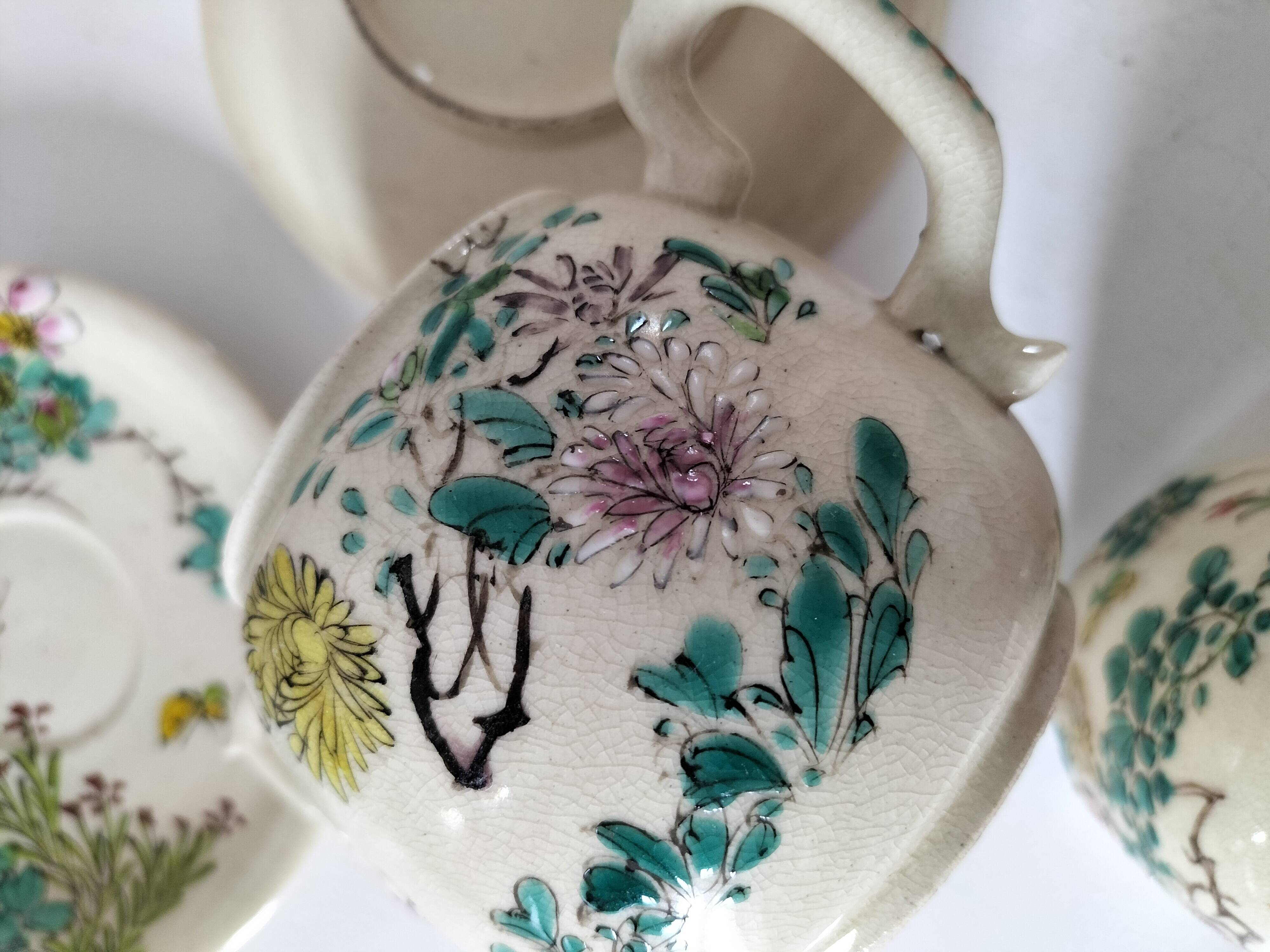 Japanese-style tea set in cracked earthenware with chrysanthemum flowers
