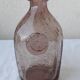 Biot bottle in bubbled glass
