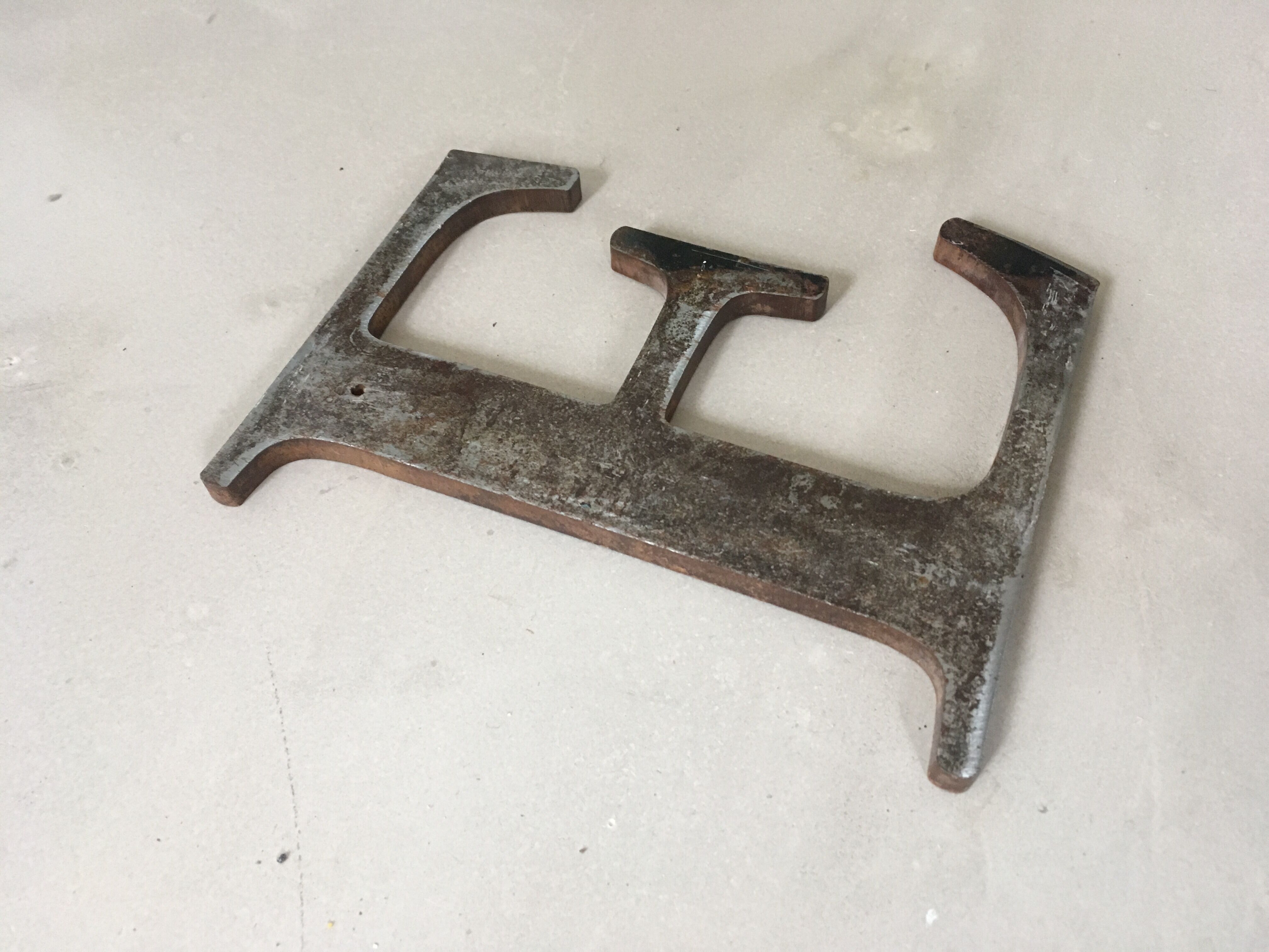 Ancient "E" sign letter