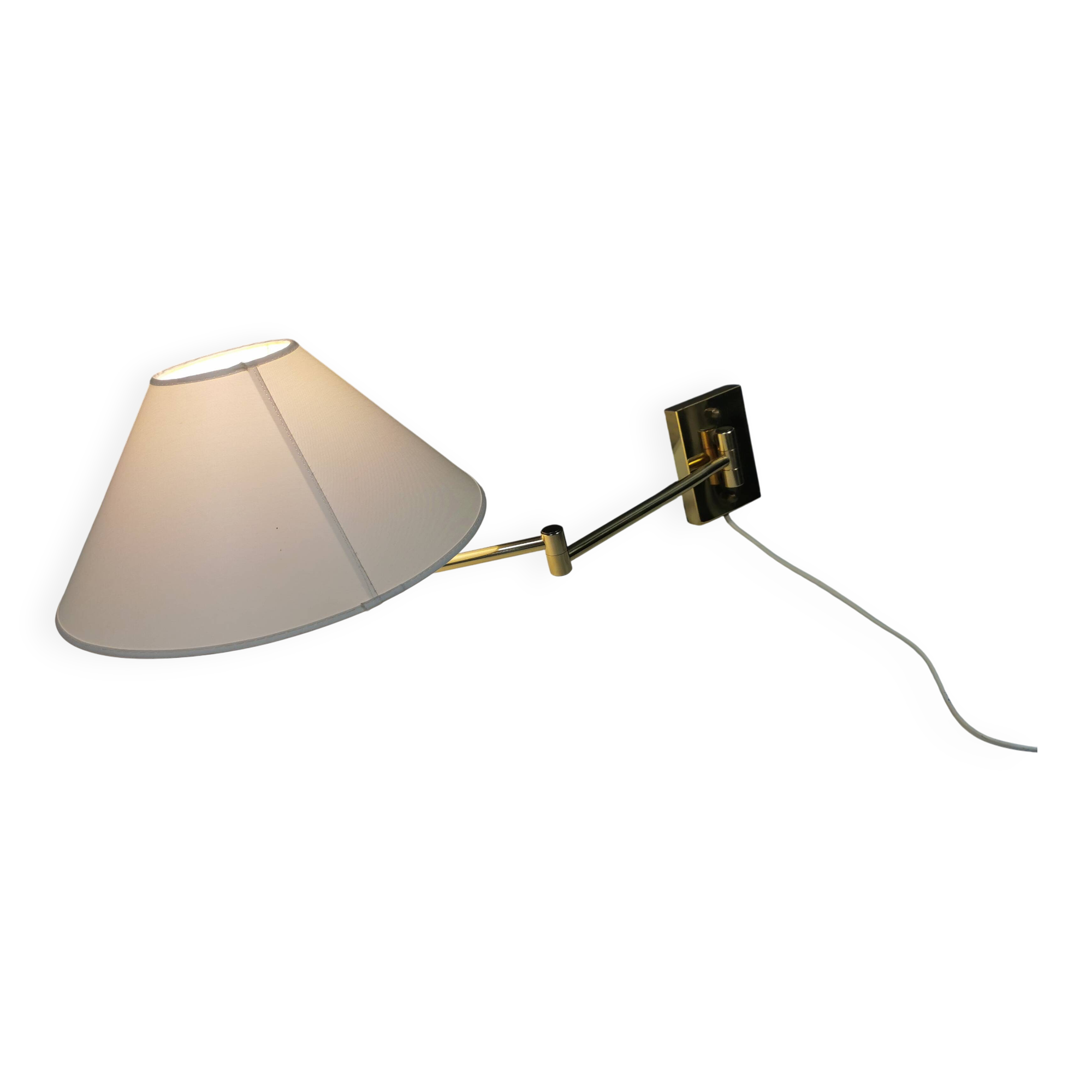 Danish Brass wall lamp with a ‘swivel’ effect.