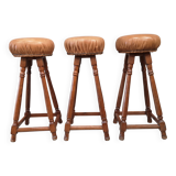 3 vintage oak and leather bar stools from the 1970s
