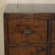 Large vintage hardwood furniture in military country style.