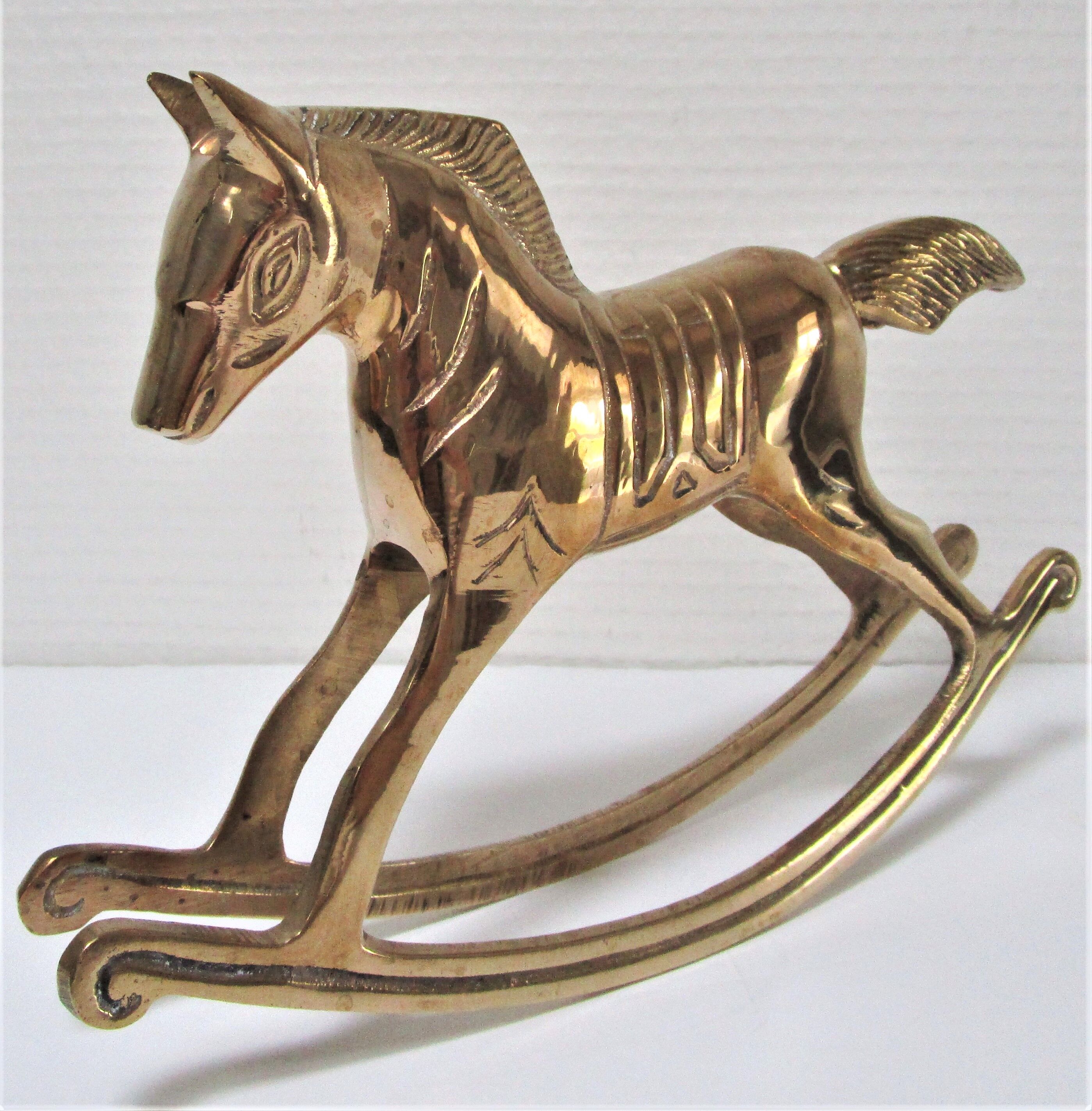 Vintage brass rocking horse 70