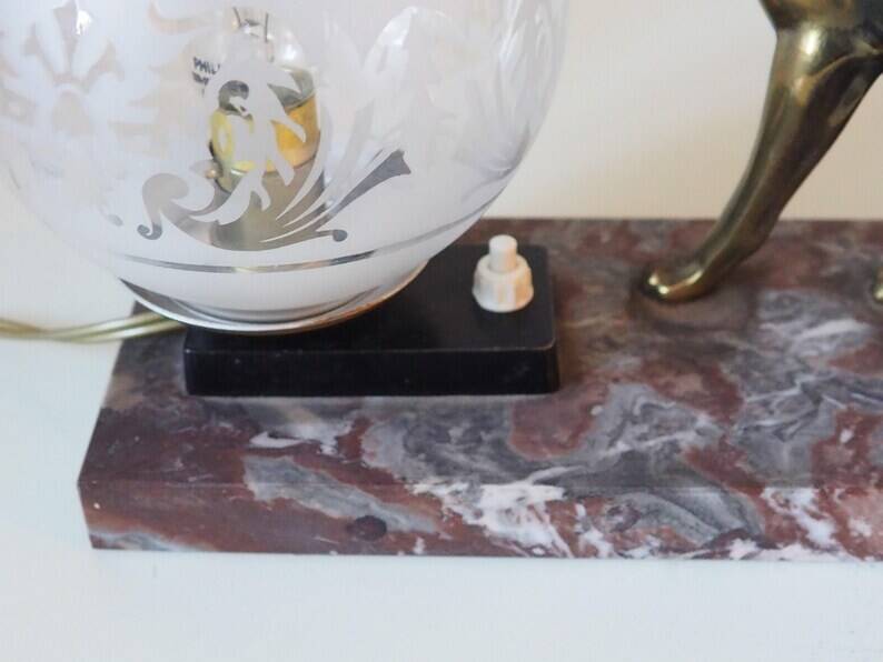 French Art Deco hunting dog on a marble base with a switched lamp.