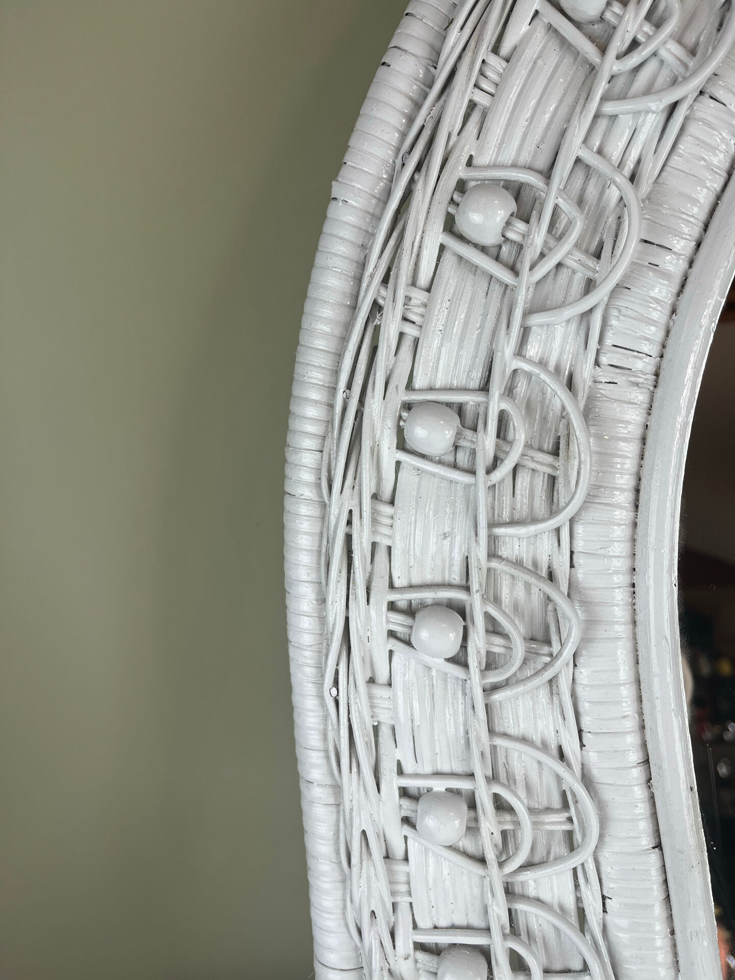 Half-moon wicker mirror