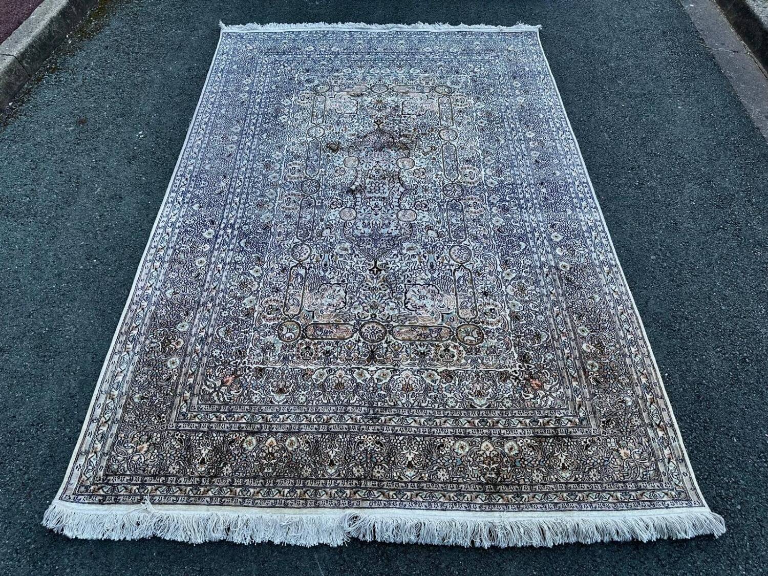 Hand-knotted Persian silk rug