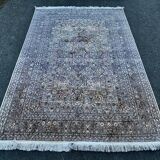 Hand-knotted Persian silk rug