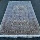 Hand-knotted Persian silk rug