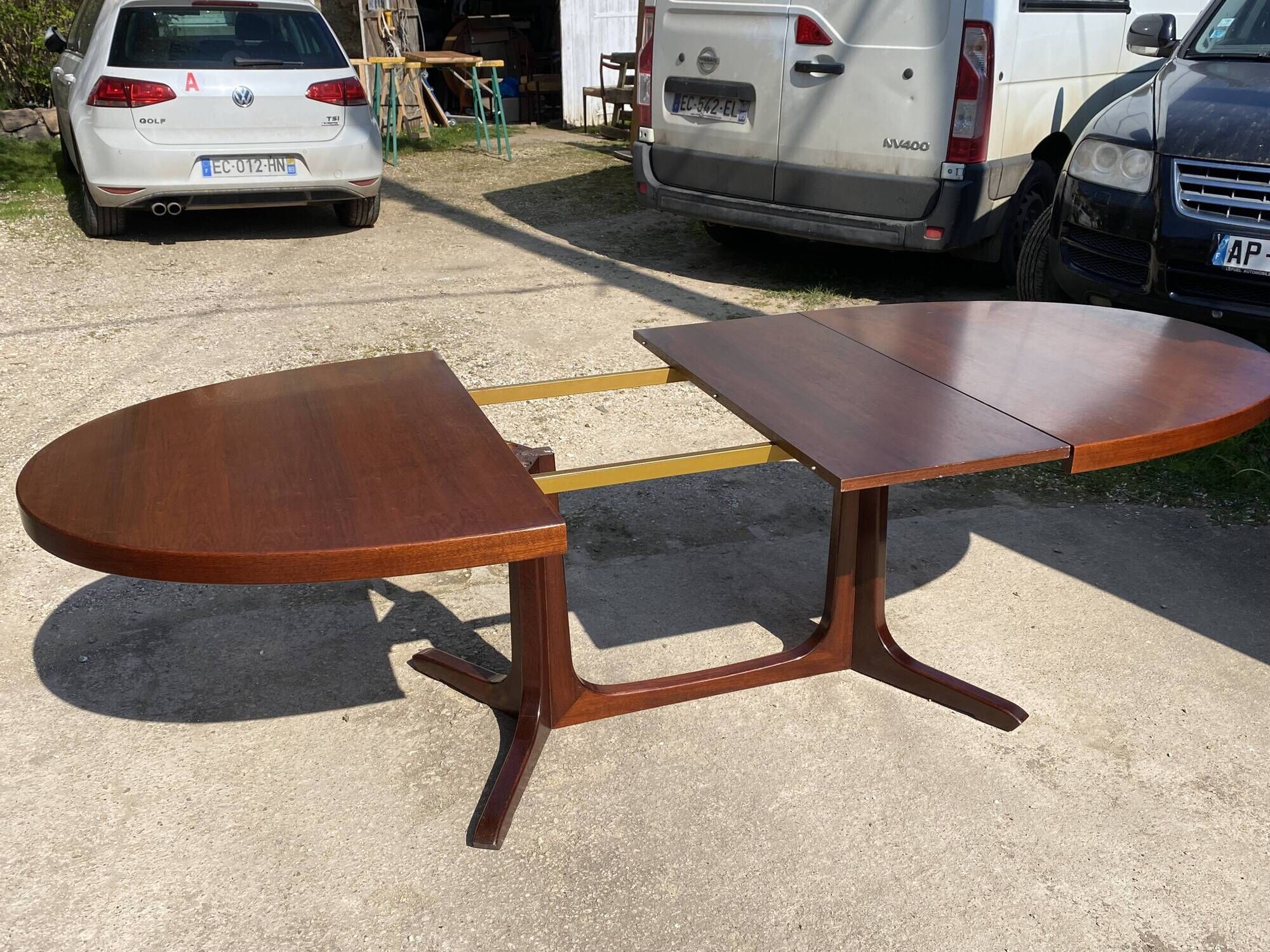 Baumann round oval extendable Scandinavian table in rosewood with 2 extensions.