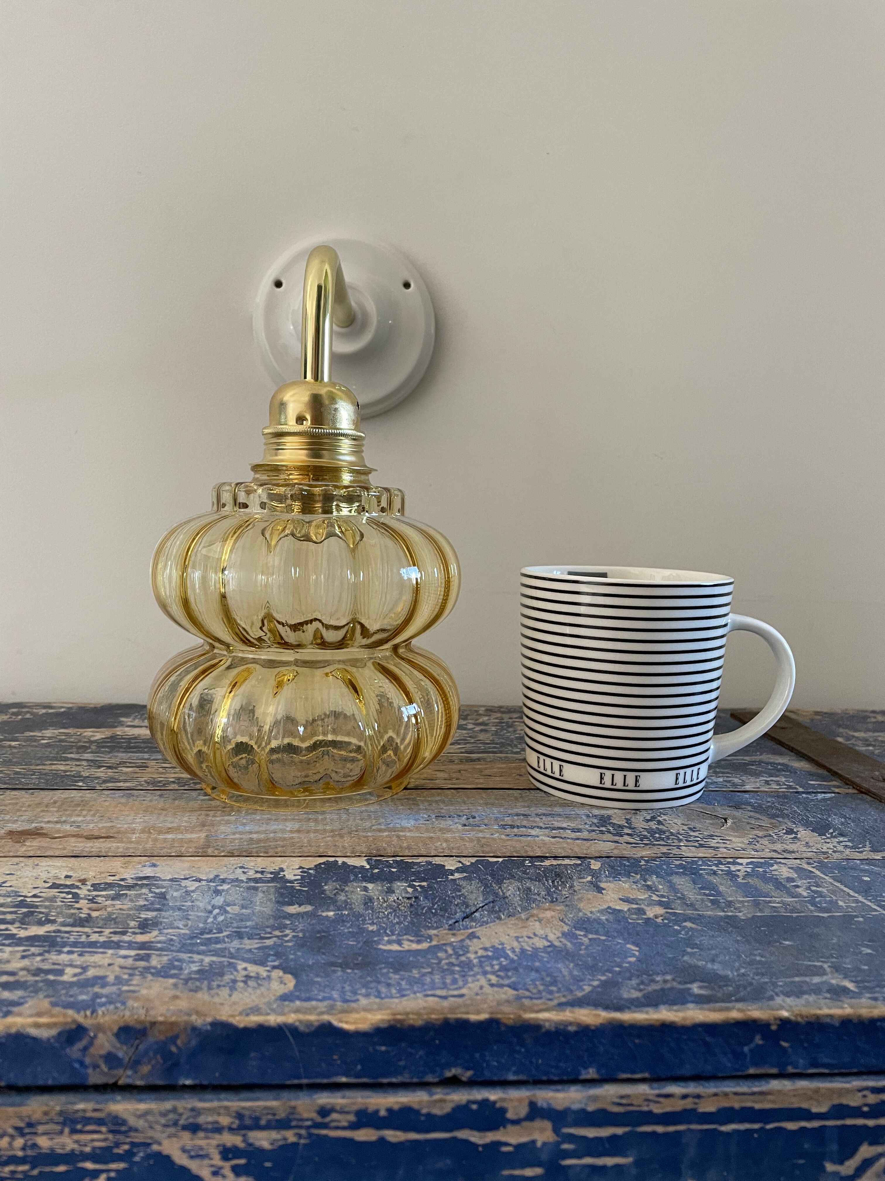 Vintage wall lamp in gilded chiseled glass