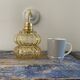 Vintage wall lamp in gilded chiseled glass