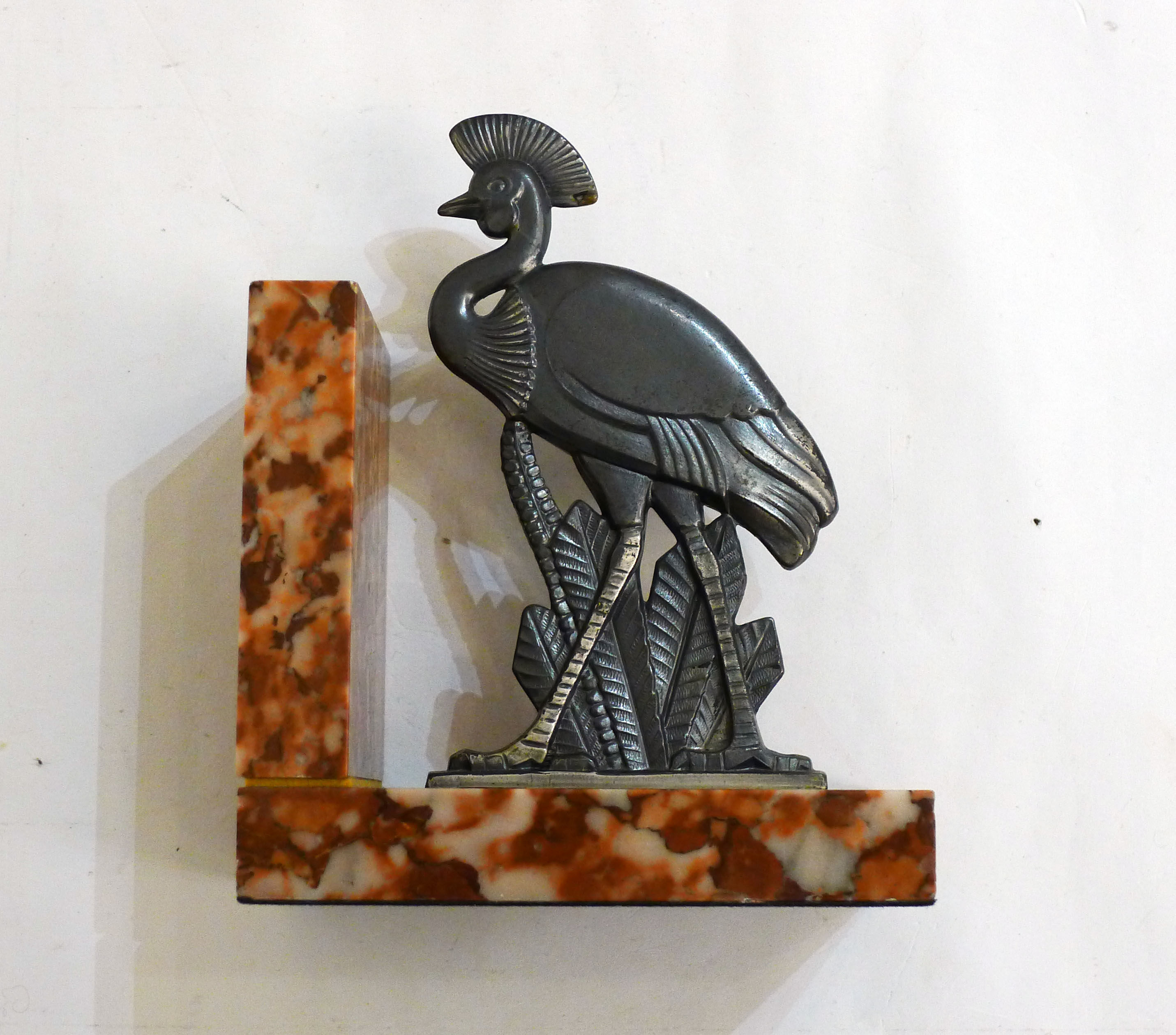 Art Deco bird bookend on marble