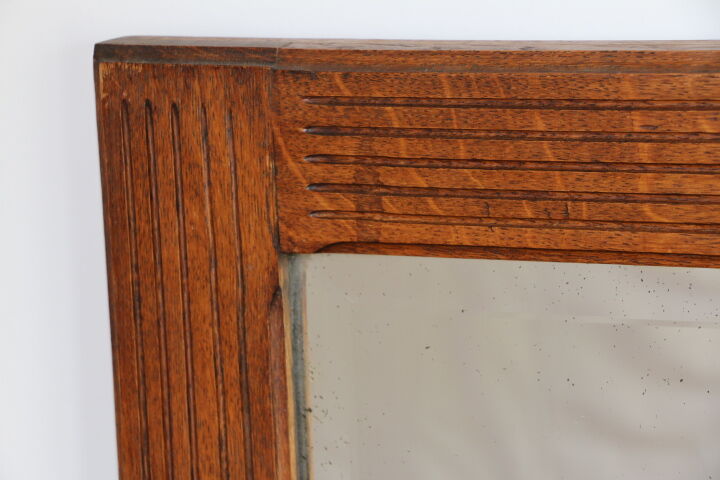 Beveled mirror grooved wood