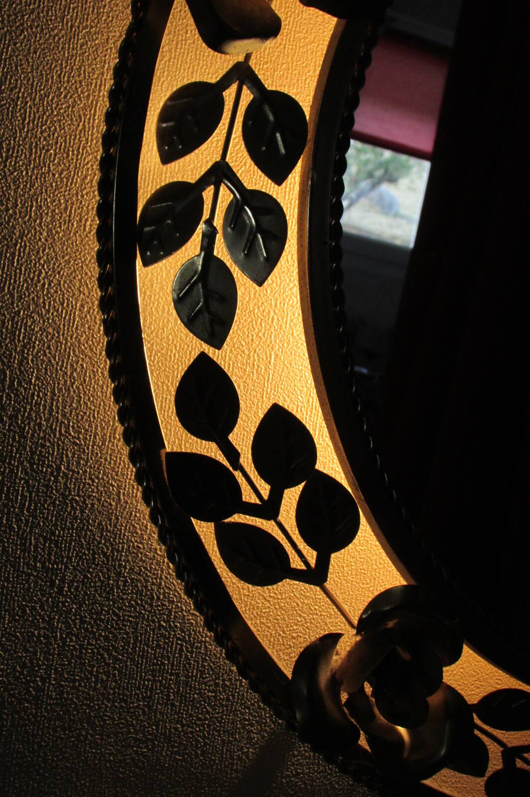 Round gold metal mirror, rose crown